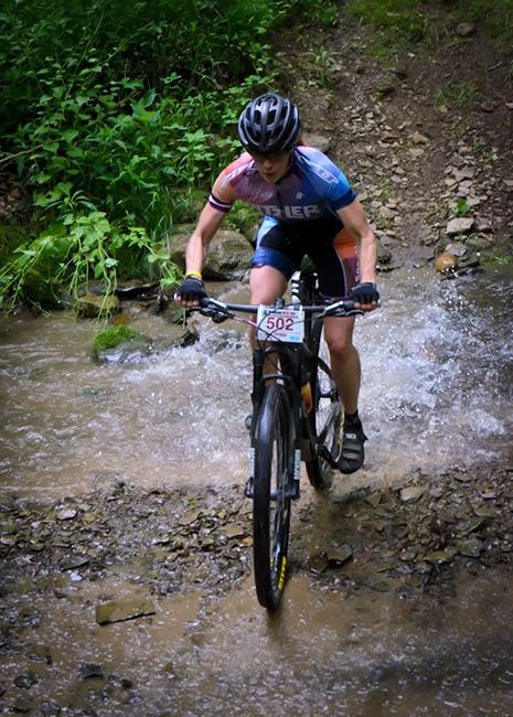 Women's 100k winner Sally Price gets wet. Photo by: Butch Phillips Photography