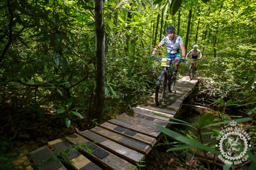 A rider makes his way across a wooden bridge in the NoTubes Trans-Sylvania Epic. Photo by Trans-Sylvania Epic Media Team