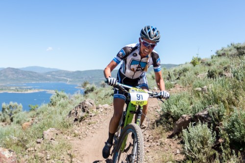 Joey Lythgoe drops the final long descent with Jordanelle Reservoir in the background. Photo by: Selective Vision Photography