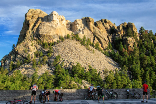 Riders stop to take in a truly unique experience at the base of Mount Rushmore - Photo by John Bush
