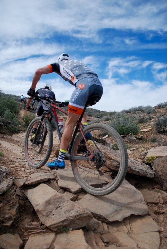 Kevin Day follows Adam Brown over some rocks. Photo by: Shannon Boffeli