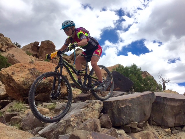 Marlee Dixon (Pivot/DNA Cycling) takes a drop on Andy's Loop. Photo by Shannon Boffeli