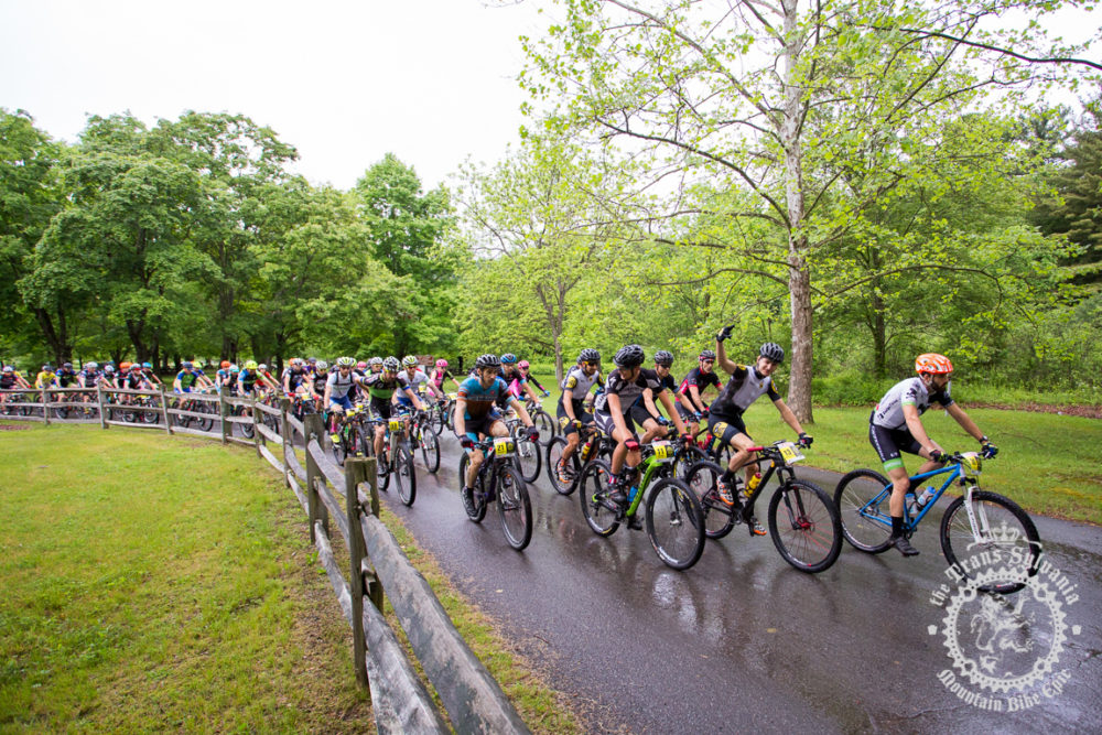 The peloton rolls out for the fifth and final time at the NoTubes Trans-Sylvania Epic. The rain held off for the start, but a 45-minute deluge drenched racers and trails mid-stage, making the rocks even more challenging than usual. 
