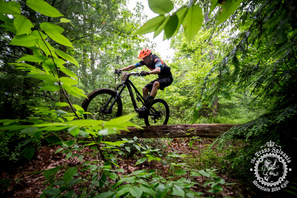 Cory Rimmer (Kona / Nox Composites / Provision Sports Medicine) pops over a log in the final stage of the NoTubes Trans-Sylvania Epic. 