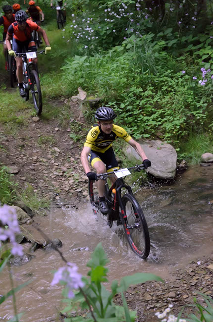 Christian Tanguy powers through the water early on in this 100 mile challenge. Photo by: Butch Phillips Photography