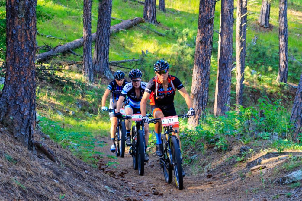 Josh Tostado leads Lamb and Johnson on the flume trail.  Photo by John Bush