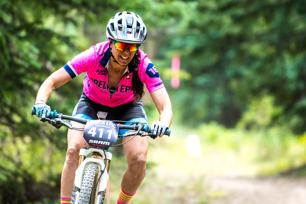 Showing true grit, Rebecca Gross rounds one of the final corners on a demanding fourth stage. Team KASK sits pretty in pink in the lead in the coed duo 6 day race. Photo by: Eddie Clark
