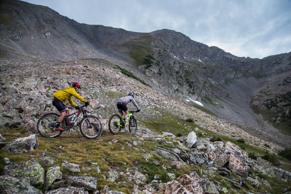 The grassy wet-land-esque fields at the summit of Wheeler can be technical, especially for exhausted riders. Photo by: Liam Doran