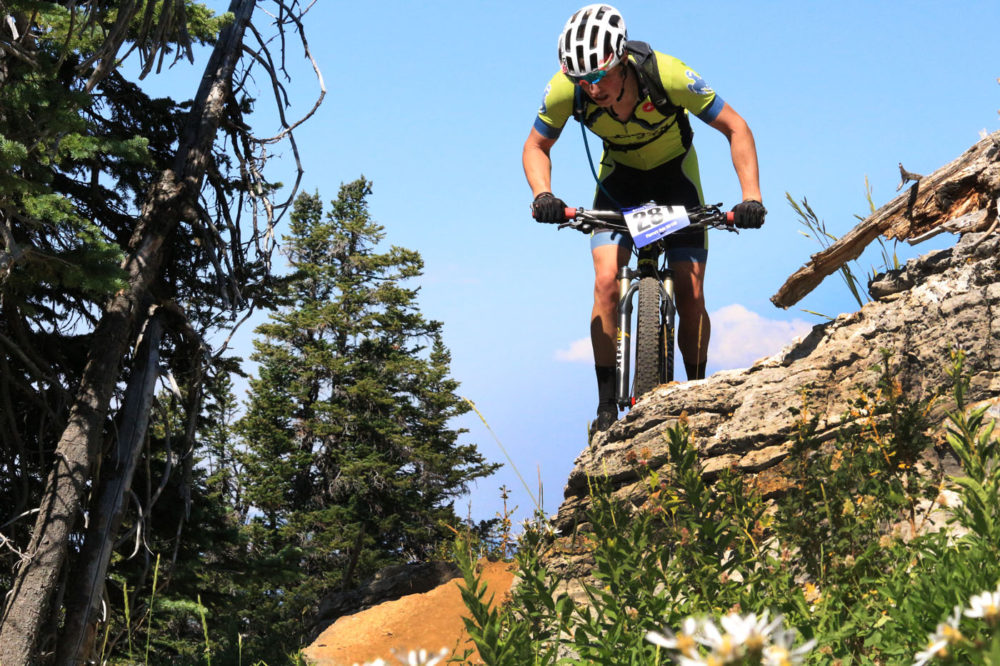 George Flynn crests a hill in the 100k event. Photo by: Cody Downard Photography