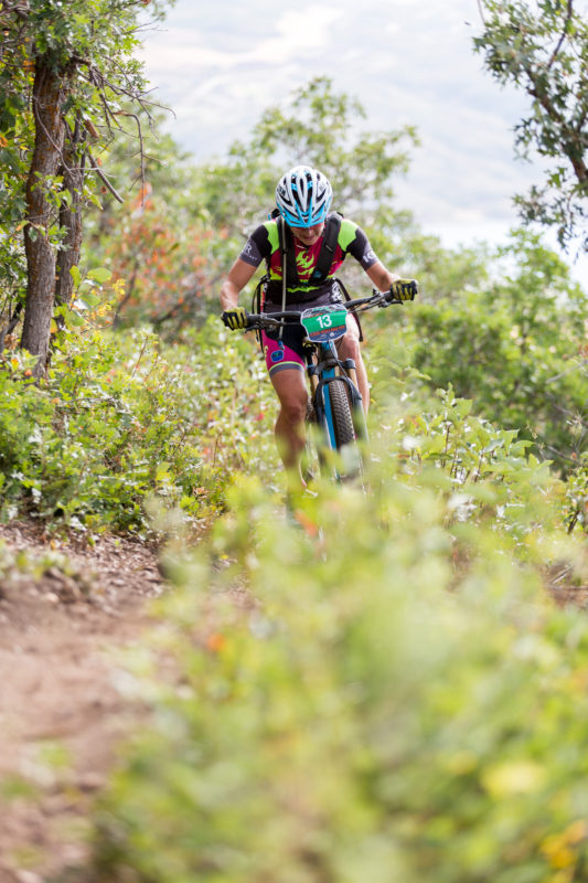 Marlee Dixon grinds out a few of the P2P's 10,000 vertical feet of climbing on her way to a second place finish. Photo by: Selective Vision